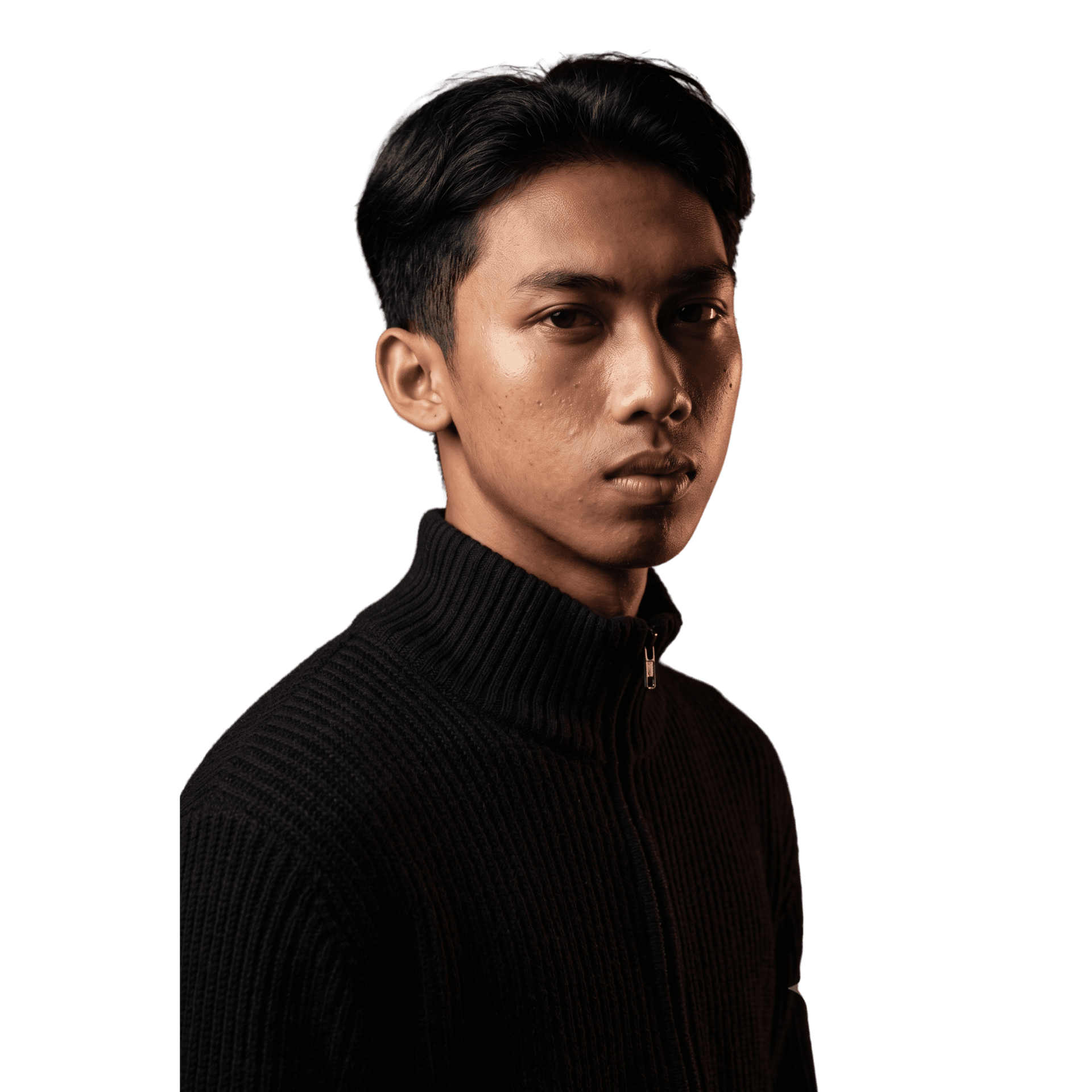 Andika working at a laptop